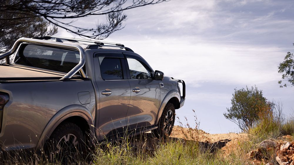 A Slate Grey GWM Ute Cannon parked on the cliff edge looking out into the distance