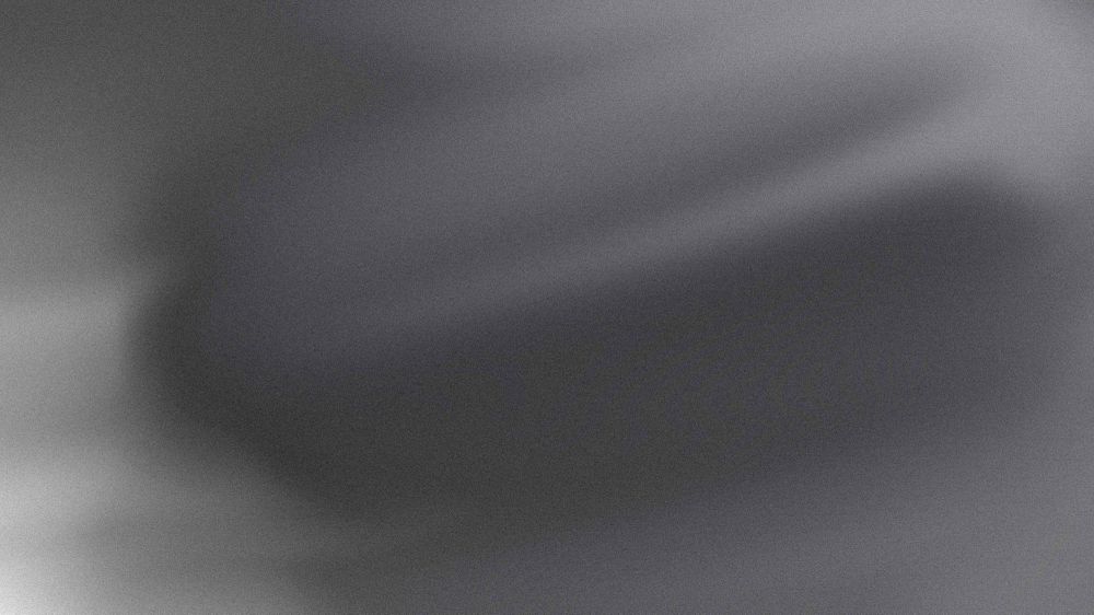 Grey gradient background that has a smoke like texture to it