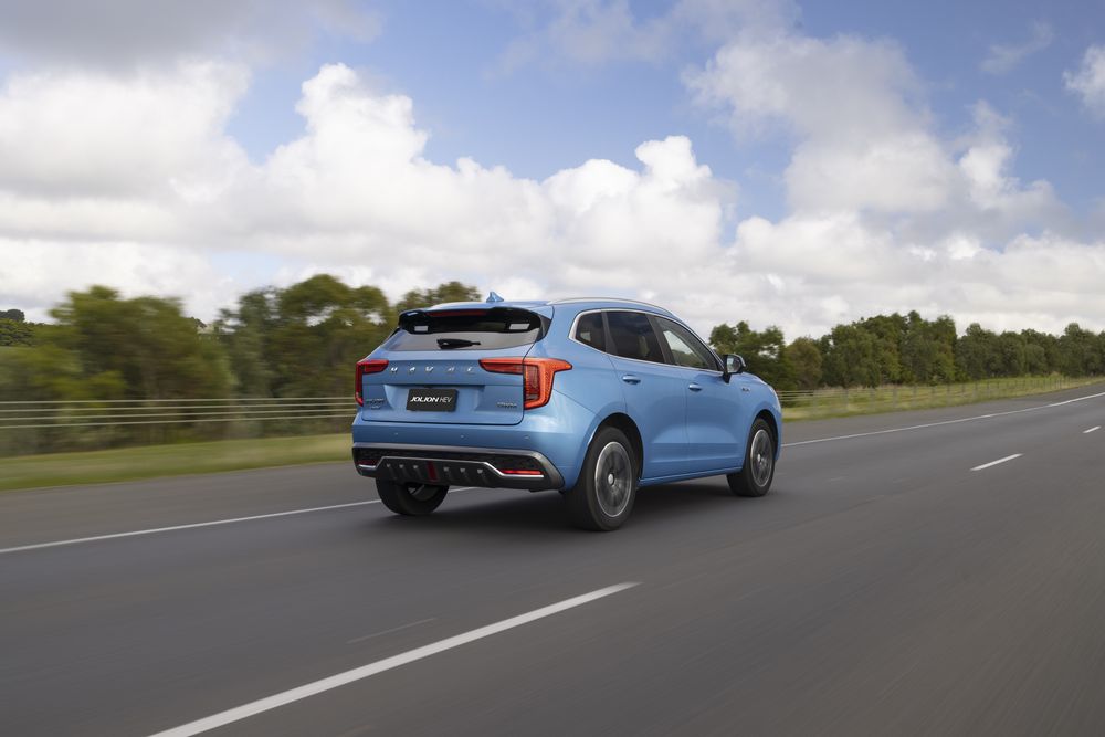Azure Blue GWM Haval Jolion driving away from the camera on a country road
