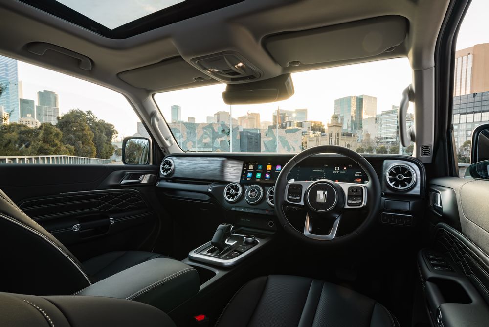 The front dash of the GWM Tank 300 with the Melbourne city buildings that can be seen through the front windshield
