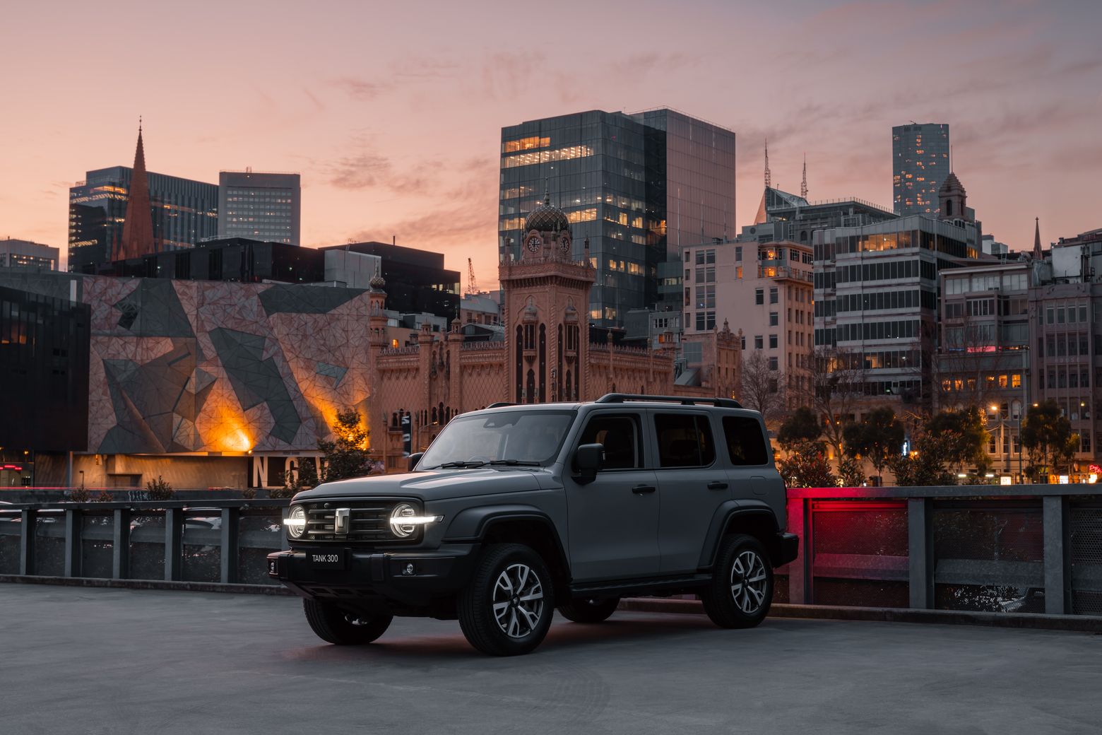 Fossil Grey Tank 300 parked on a roof top carpark with the city in the background